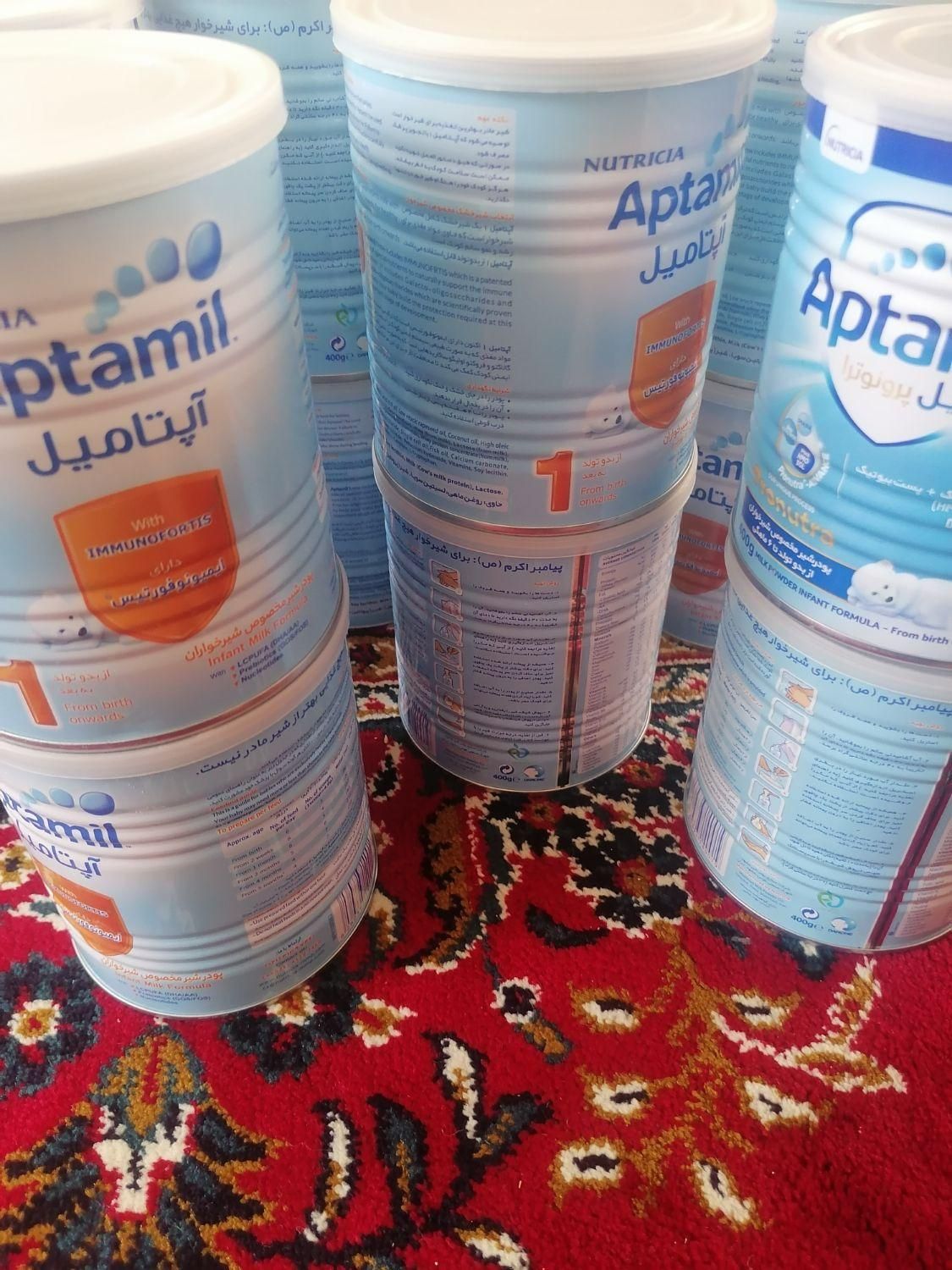 تعدادی قوطی شیر خشک|ظروف نگهدارنده، پلاستیکی، یک‌بارمصرف|فسا, |دیوار