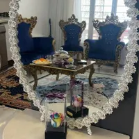 آیینه و شمعدان به همراه ساعت