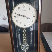 ساعت دیواری پاندول دار آرام گرد