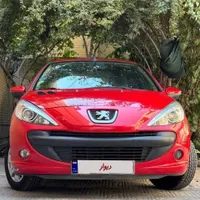 پژو‌۲۰۷ قرمز دنده‌ای سقف فلزی فرمان برقی مدل ۹۹