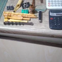 دوعدد ماشین حساب دو زربین دوعدد خودکار چوب سیگار