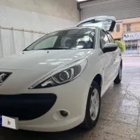 ماشین ۲۰۷ پانا دنده ای سفید ارتقا مدل ۱۴۰۴ با رینگ