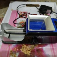 دستگاه سیگار پر کن.