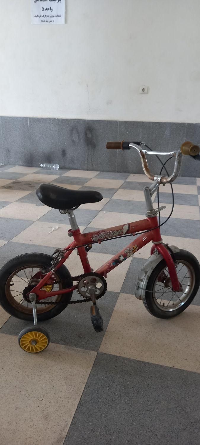 ** دوچرخه سایز ۱۲ با کمکی  **|دوچرخه، اسکیت، اسکوتر|ارومیه, |دیوار
