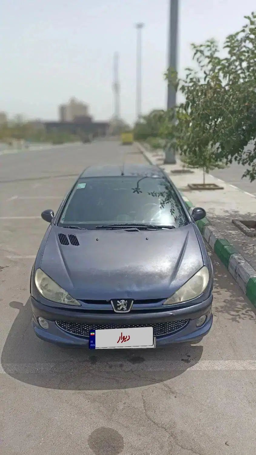 ۲۰۶ اس‌دی مدل ۸۹ ، رنگ آبی متالیک یا کاربنی|خودرو سواری و وانت|مشهد, کوه سنگی|دیوار