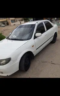 مزدا ۳۲۳ سفید اتومات سالم و کم خرج