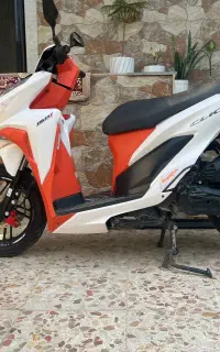 موتور کلیک 150 سفید نارنجی