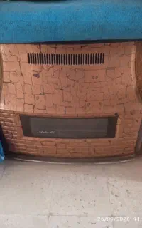 یک عدد بخاری گازی بزرگ ۱۴۰۰۰ و یک بخاری طرح شومینه