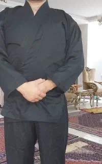 لباس رزمی سیاه در حد نو