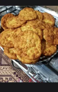 نان روغنی کنجدی و پفیلا (ذرت)ادویه تخمه گردو مویز