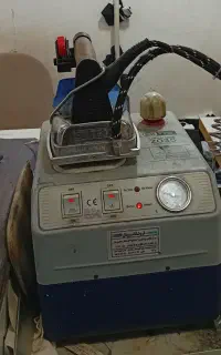 اتو بخار مخزن دار و میز مکش سیلتر