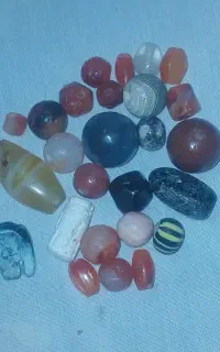 مهره قدیمی و سوراخ دار