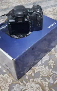 دوربین عکاسی کنون با جعبه و کیف در حد نونو