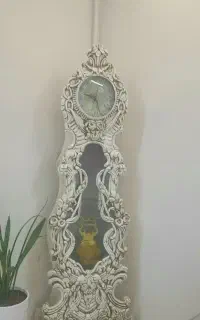 ساعت ایستاده و آینه و شمعدان