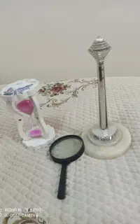 ذره بین ساعت شنی برج میلاد