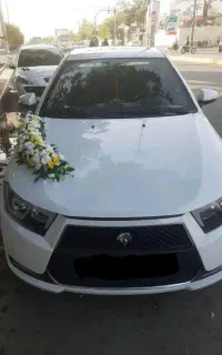 اجاره ماشین عروس دنا پلاس سفید گل آرایی ماشین عروس