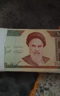 یکصد قطعه اسکناس ۱۰۰۰ریالی مقطوع