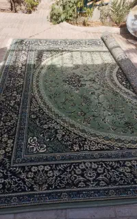 یکعدد فرش 12متری سبز رنگ