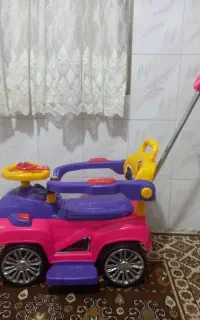 ماشین اسباب بازی چهارچرخ دسته دار