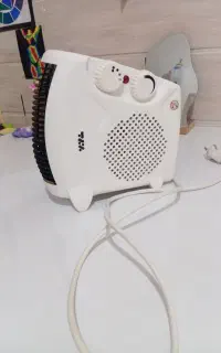 بخاری برقی هم گرم کن هم فن