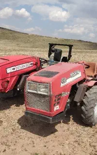 شخم باغ با تراکتور کمرشکن باغی