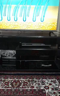 میز تلویزیون شیشه ای در حد