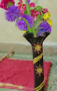 گلدان و گل مصنوعی
