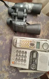 یک تلفن اصل پاناسونیک و یک دوربین شکاری رنگی عالی