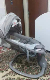 گهواره برقی روروئک ست رختخواب و قنداق فرنگی