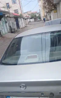 ماشین مزدا۳۲۳ رنگ نفره ای