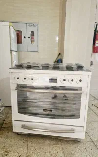 اجاق گاز فردار مبله صفحه شیشه ای نوژن در حد نو