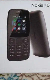یه دستگاه گوشی نوکیادوسیم کارت باباتری وشارژر