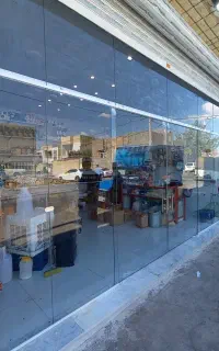 نصب شیشه سکوریت درب مغازه و ویترین