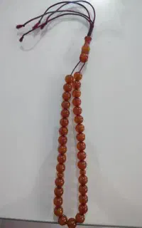 تسبیح کهربا رگ دار