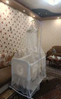 تخت نوزاد و پشه بندninico
