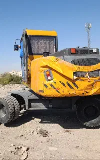 اجاره مینی بیل لاستیکی حمل نخاله و خاکبرداری