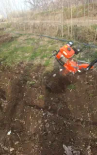 کار با کولتیواتور شخم زدن باغ و زمین خریدار چوب