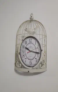 ساعت دیواری طرح قفس پرنده