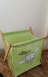 سبد اسباب‌بازی کودک طرح کارتونی سبز رنگ