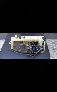 اتو و دستگاه دکمه زن1800000