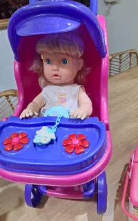 عروسک با کالسکه