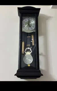 ساعت دیواری کمددار