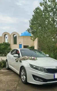 اجاره ماشین عروس اپتیما رنگ سفید 2400cc