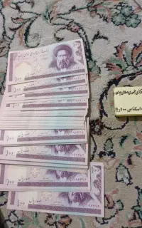 100 عدد اسکناس 100 ریالی
