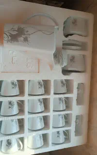 فنجان و قوری وقندان شکر پاش