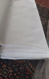 پارچه لباس مردانه .سفید. یک مترونیم عرض بروجرد