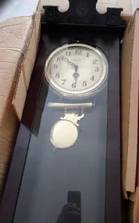 ساعت دیواری آونگ دار زنگ خور