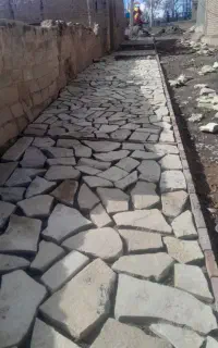 اجرا ی سنگ فرش وجدول محوطه سازی