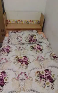 تخت یکنفره کشودار و دارای محل انباری