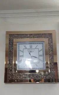 ساعت دیواری گوشواره ای